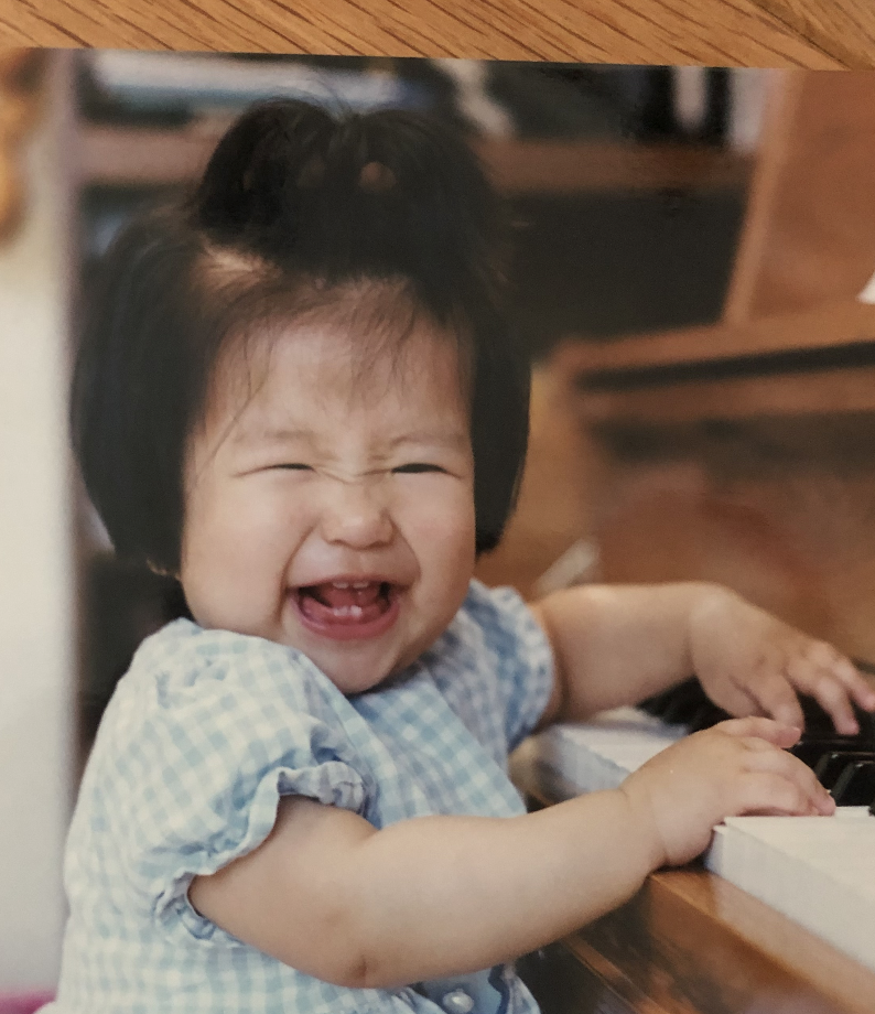 photo of baby gabby playing piano